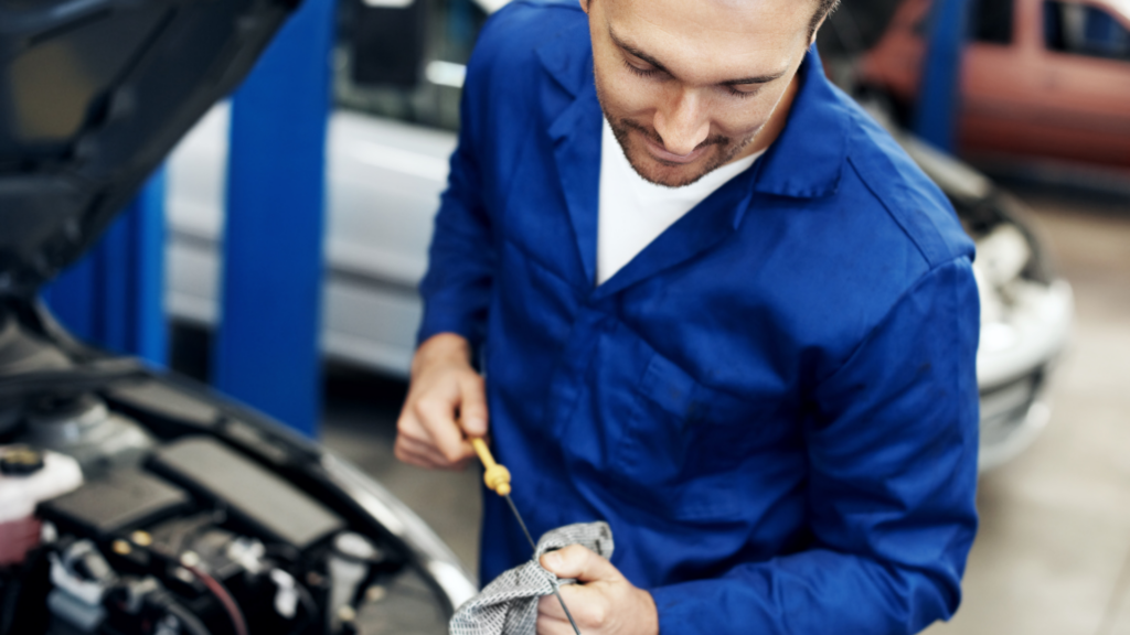 strickland brothers 10 minute oil change employee wiping equipment